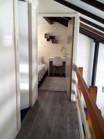 Gang met op het einde slaapkamer met 3-persoonsstapelbed